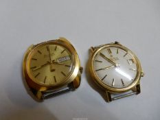 A Bulova Accuquartz wristwatch with day/date window at the 3 o'clock position,