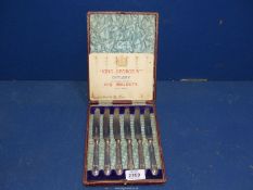 A leather box, silver handled Fruit knives by George V, hallmarks for Sheffield 1910, makers J.