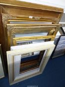 Seven large picture frames including five gilt frames.