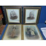 Two ornate black and gold framed portraits of gentlemen,