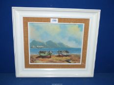 A white wood framed oil on boards of a continental seascape with two boats anchored on the beach,