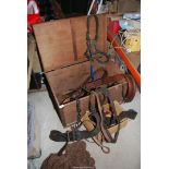 Large wooden chest of heavy horse gear incl. head collar, reins etc.