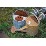 Galvanised mop bucket and watering can.