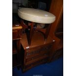 Faux leather stool and chest of drawers.