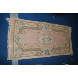 Chinese wool rug, pink with floral pattern, 5' x 2' 6".