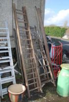 Seven rung wooden stepladder and nine rung wooden extension ladder.