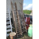 Seven rung wooden stepladder and nine rung wooden extension ladder.