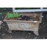 Cast iron rectangular Planter with central wreath design to front and fluted details,