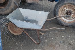 Galvanised wheelbarrow with a solid tyre.