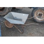 Galvanised wheelbarrow with a solid tyre.