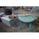 Plastic circular table, birdbath, stainless steel garden rake, broom, shovel.