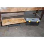 Small table and toolbox.