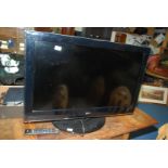 Large 36" flat screen TV with remote.