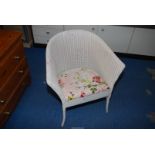 Lloyd Loom tub chair.