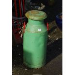 Green painted milk churn.