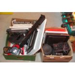 Photographic enlarger and box of photography equipment.