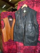 A tan leather waistcoat, size 44" and a black leather gillet by Hidepark, size 3XL.