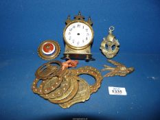 Eight various horse brasses and a brass and china harness decoration,