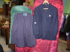 A gent's Austin Reed navy pinstripe suit, size 44, together with Dunn & Co. navy pinstripe jacket.