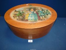 An oval bentwood Box, the box advertising champagne with image of Victorian ladies dancing,