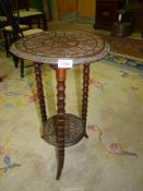 A pedestal table with lower shelf, carved pattern, 25 1/2'' high.