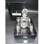 A boxed Royal Doulton crystal giftware to include four sherry glasses and a decanter.