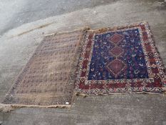 Two bordered, patterned and fringed rugs,