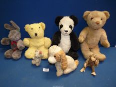 A quantity of vintage soft toys including panda, rabbit, puppy, monkey and Teddy bears.