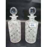A pair of cut glass Decanters, straight sided with lattice cut detail.