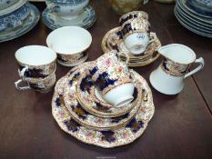 A Salisbury bone china Teaset for six, in royal blue, gilt and floral design.