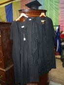 Two graduation/barrister Robes, one made by Ede and Ravenscroft robe makers,