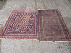 Two bordered, patterned and fringed rugs, 5 1/2" x 2' 11" and 4' 10" x 2' 8", both worn.
