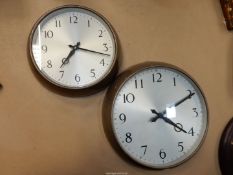 Two metal framed Wall Clocks with Arabic numerals, one 8 3/4'' diameter with clockwork movement,