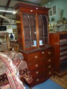 A compact and desirable Mahogany secretaire Bookcase having Gothic arch shaped glazed doors (one