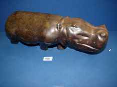 A heavy African hardwood carved figure of a Hippopotamus, 18" long.