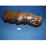 A heavy African hardwood carved figure of a Hippopotamus, 18" long.