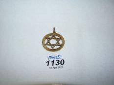 A gold 9ct "Star of David" medallion marked C.M.G. 25th November 1964.