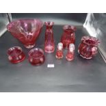 A quantity of Dartington ruby red glass including fruit bowl, trinket pots, tall vase,