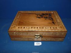 An inlaid and pierced detail wooden box.