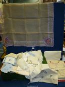 A quantity of linen including embroidered tablecloths, lace, etc.