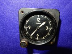 A black Bakelite military/aviation type dashboard Clock by the Bulova Watch Co.