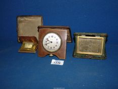 Three leather cased travel Clocks,