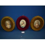 Three contemporary oval portraits of ladies in period dress, all in velvet frames, 9'' long.