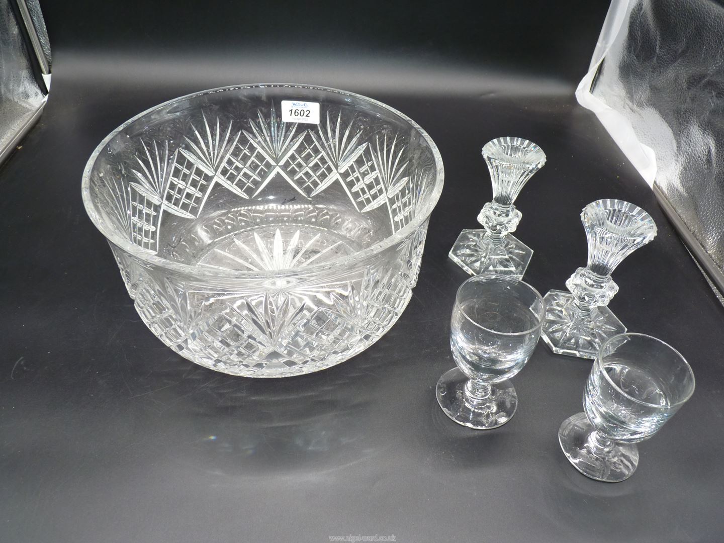 A very large and heavy fruit/punch bowl, pair of Waterford crystal candlesticks, etc.