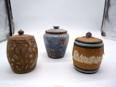 Two Doulton Lambeth and one Slaters stoneware Tobacco jars with lids.
