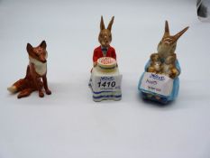 Three animal figures including Royal Doulton Rabbit with birthday cake,