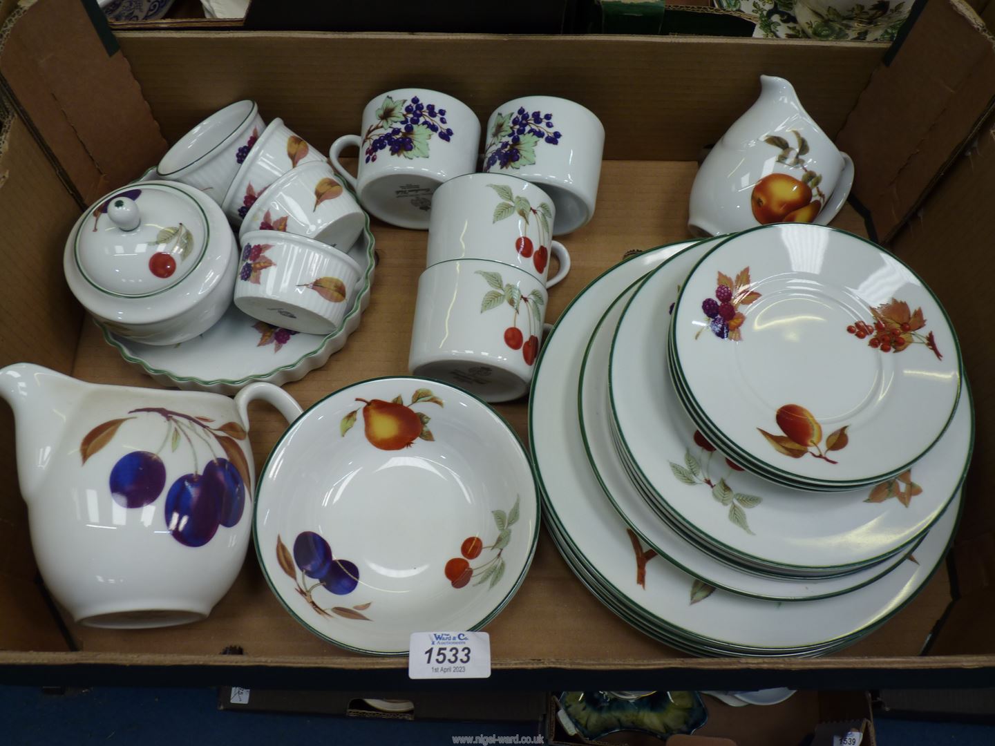A quantity of Royal Worcester 'Evesham Vale' china including dinner and side plates, cups, saucers,