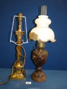 An oriental oil Lamp with cast metal base, clear chimney and white shade, a/f, 22" tall,