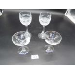 A pair of Irish Crystal hock glasses with engraved crown above clasped hands, stamped Galway,