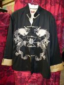 A black and gold Oriental Silk jacket with a dragon embroidery to the front, size XXL.